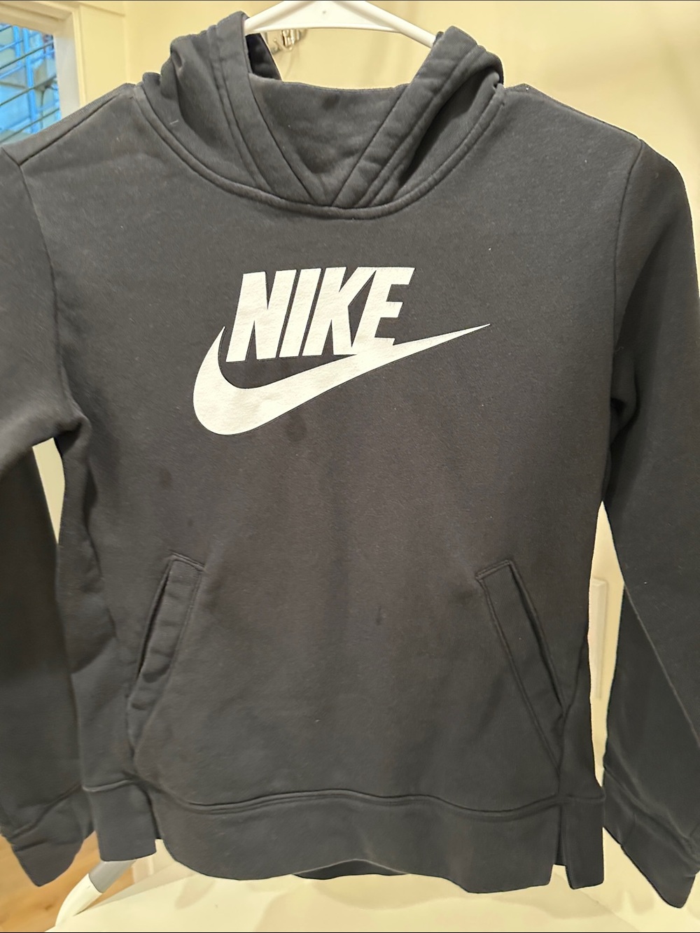 Nike Black Hoodie with White Swoosh Logo and two side slits for one pocket